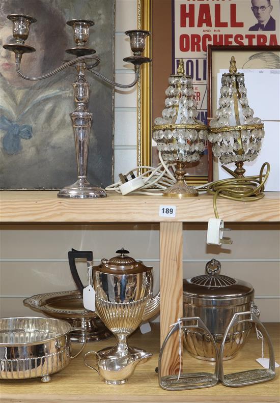 A collection of plated items, including an ice bucket, a pair of lustre table lamps and a pair of stirrups